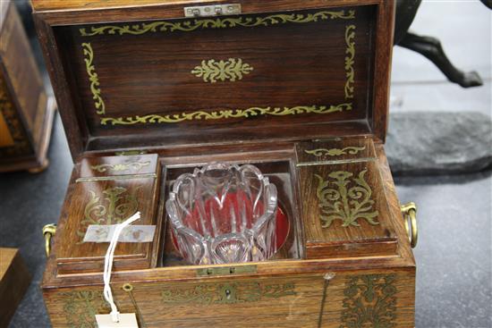 A Regency rosewood and brass inlaid sarcophagus shaped tea caddy, 13.75in.